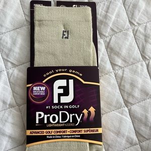 Brand new Foot Joy Pro Dry crew socks.  Light khaki in color.  One size fits all